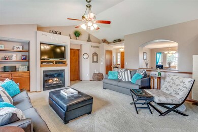 Custom built-in bookshelves and a gas fireplace co