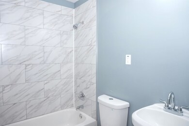 Full bath with a sink and bathtub / shower combination