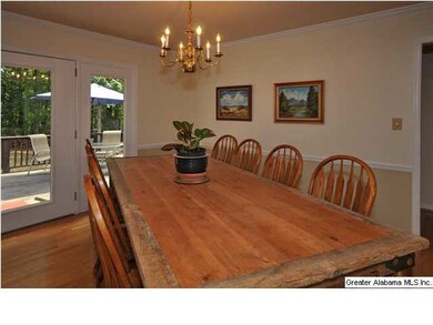Beautiful dining room features hardwood flooring a