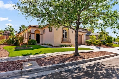 Mediterranean / spanish-style house with concrete driveway, a front yard, a tiled roof, stucco siding, and an attached garage