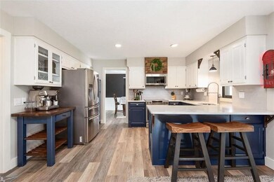 Quartz countertops, refaced cabinets and LVP floor