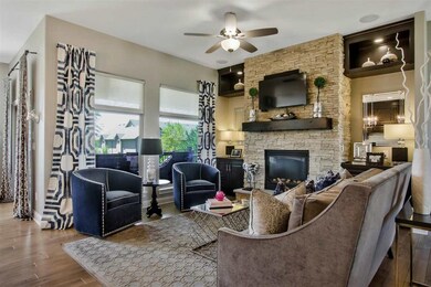 Stone covered fireplace with custom built ins. Gre