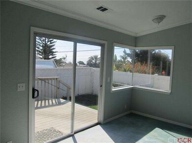 Gaze out at a peak of the ocean from inside your b