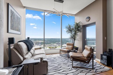 Sunroom / solarium featuring an inviting chandeli