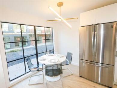 Dining area featuring light wood finished floors 