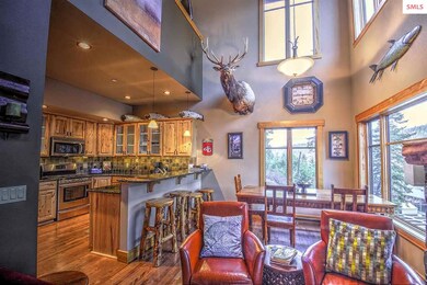 Soaring ceilings and stone fireplace in great room