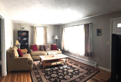 Spacious Living Room With Hardwood...