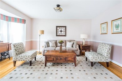 Living room with bay window and chair rail