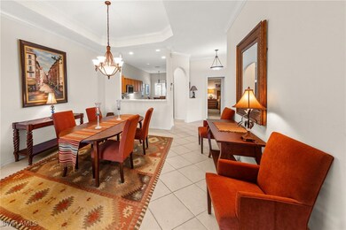 Dining area featuring light tile patterned floors,