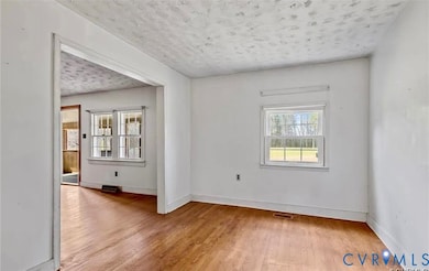 Dining room featuring light wood finished floors and baseboards