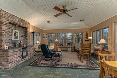 Sunroom has heat, A/C, stone floors, wood walls an
