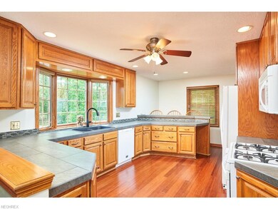 Kitchen with large windows to let in light. Tastef