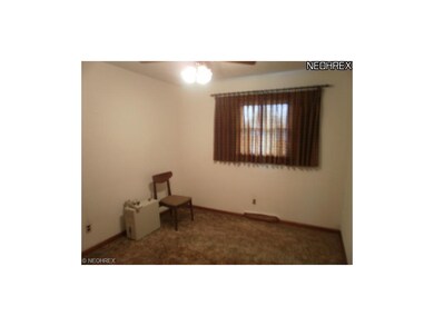 Large bedroom with wall to wall carpet, ceiling fa