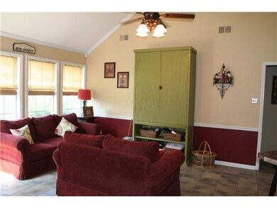 Hearth Room has a sea of windows and opens up to K
