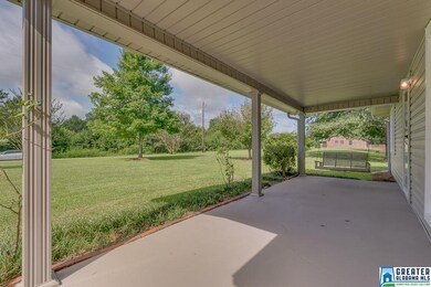 The porch is concrete and spacious.