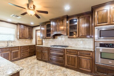 Gorgeous large kitchen with custom cabinets, grani