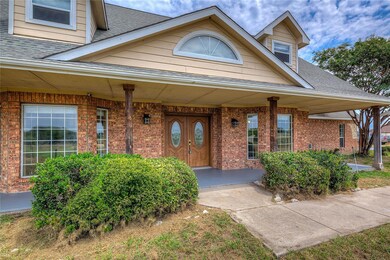 View of front facade with  front covered porch