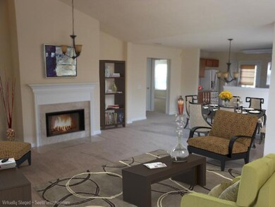 This picture is digitally staged - there is no furniture in the home and no furnishings seen here are included in the sale.