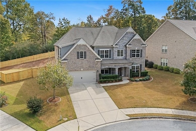 Craftsman-style home with covered porch, concrete driveway, brick siding, an attached garage, and roof with shingles
