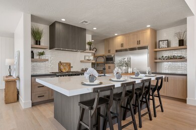 Kitchen featuring open shelves, light wood finished floors, decorative backsplash, recessed lighting, and a textured ceiling