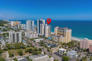 Birds eye view of property with a beach view and a