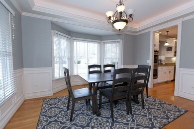 Fresh paint and wainscoting detail with hardwood f