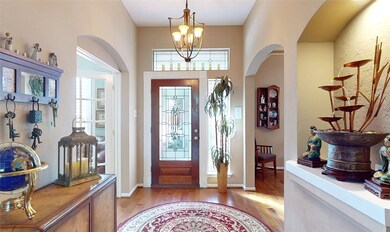 Lots of light comes through the leaded glass front door, its sidelight and the transom window above it.  The gorgeous wood floors just gleam!