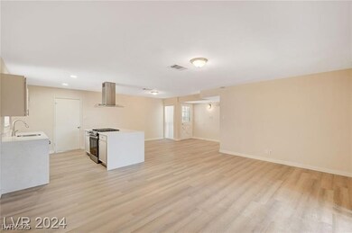 Kitchen featuring stainless steel range with gas s