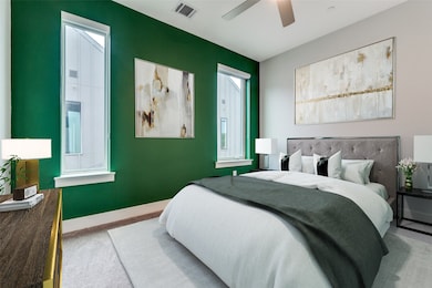 Carpeted bedroom with baseboards and a ceiling fan