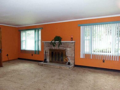 Living Room. 2 Large windows, crown moulding and o