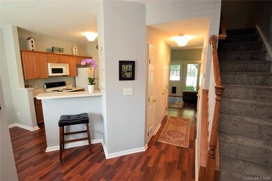 Enter the spacious townhouse with fresh laminate f