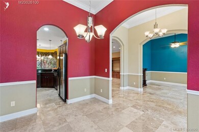FORMAL DININGROOM, ENTRY AND DEN AREA. ENTRY INTO