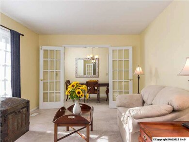 The reverse view of the formal living room shows the dining room at the far end.