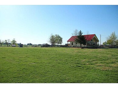 Exterior Front. Acreage is fenced in front for goa