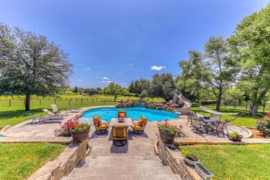 Inviting pool with great water feature and slide