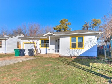 Single story home with a porch, a front yard, and 