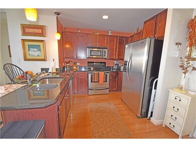 Kitchen has cherry cabinets, granite counters and 
