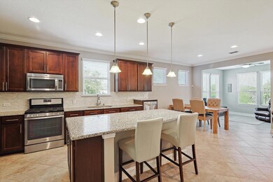 Kitchen with decorative backsplash, decorative lig