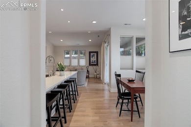 Dining area featuring recessed lighting, light wood-type flooring, and baseboards
