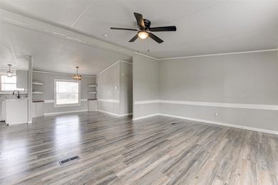 Unfurnished living room with dark wood-type floori