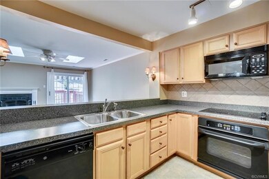 Kitchen opens to Living Room.