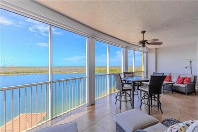 Sunroom / solarium with a water view, tile pattern