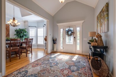Welcoming Vaulted Entry, natural lighting from the leaded glass and sidelights, solid hardwood floors, exceptional moldings and architectural elements that continues throughout this home. Open, flowing rooms perfect for entertaining.