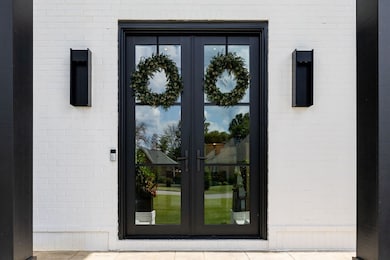 Gorgeous heavy metal and glass Pella Doors
