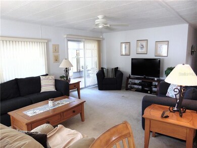 Living room with water view and sliding glass door