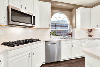 This kitchen has under cabinet lighting, which provides task lighting and ambiance. The lighting is controlled by a wall switch, making it easy to adjust the brightness to suit the occasion. The under cabinet lighting is a great feature that adds bot