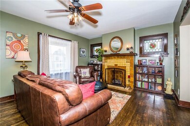 Living Room - Original stained glass windows flank