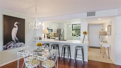 The open-concept kitchen blends seamlessly into the dining room just beyond—perfect for casual meals, intimate dinners, and everything in between.