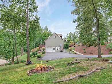 Spacious yard with fire pit.