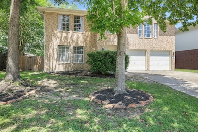 This charming two-story brick home features a doub